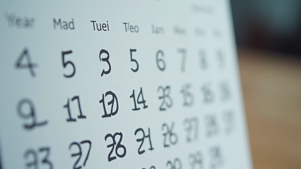 Close-up view of a calendar with marked dates