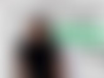 Smiling person in black shirt sits in an office. Text: "5 places to LAND CLIENTS FAST!" with bold green and white background.