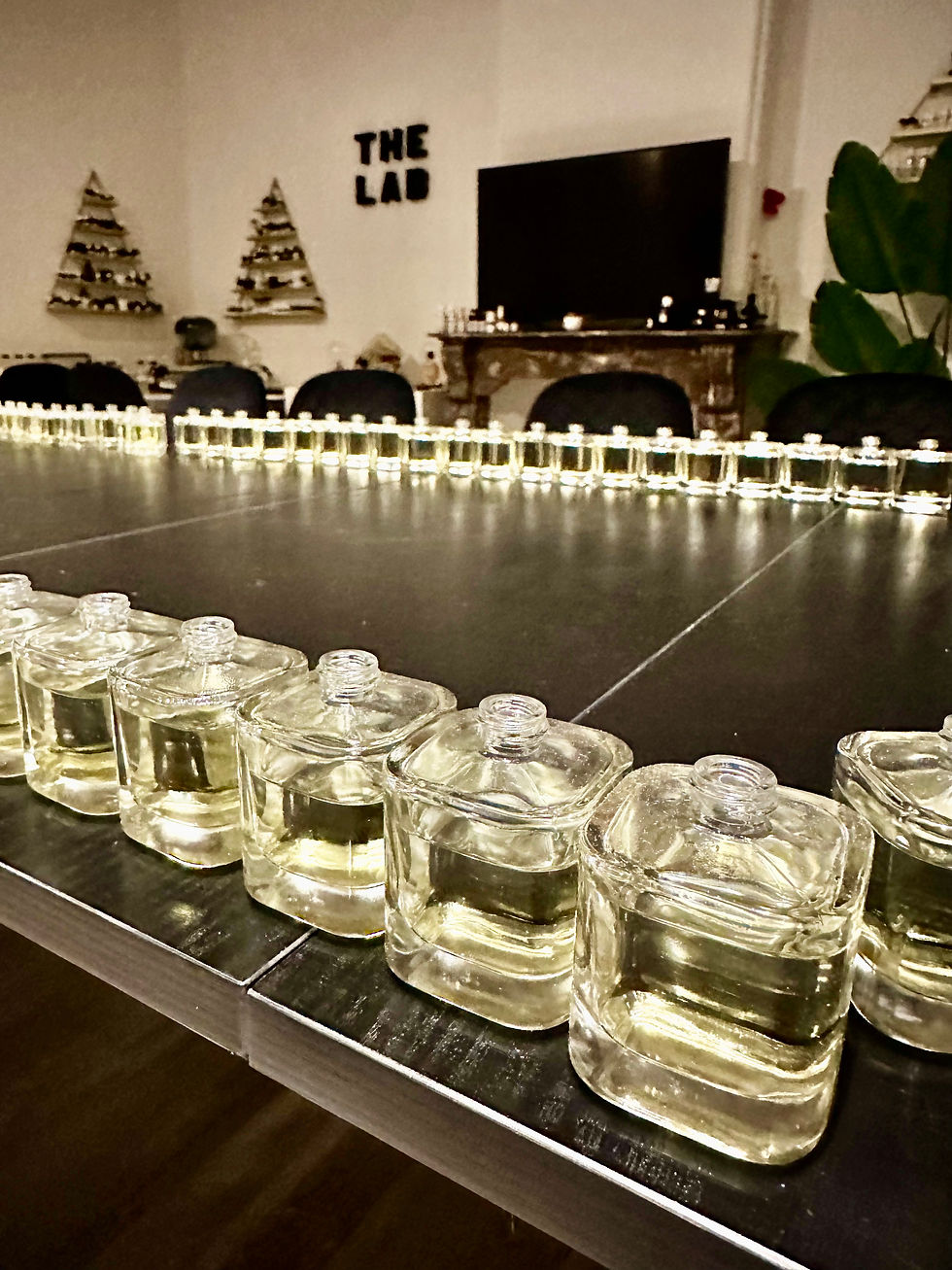 Close-up view of elegant perfume bottles arranged on a wooden table