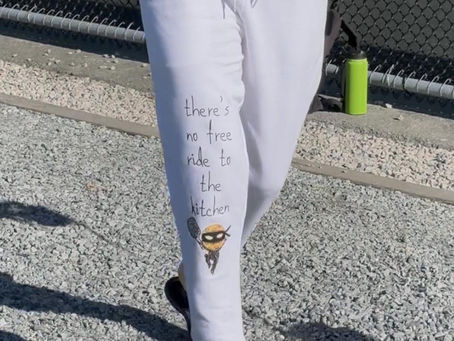 me wearing sweatpants that say: No free ride to the kitchen