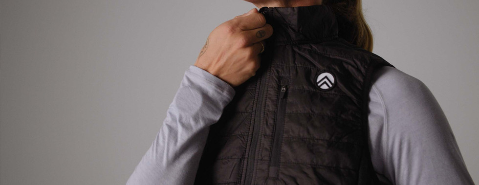 model demonstrating multple forms of zippers on sky manufacturing athletic apparel