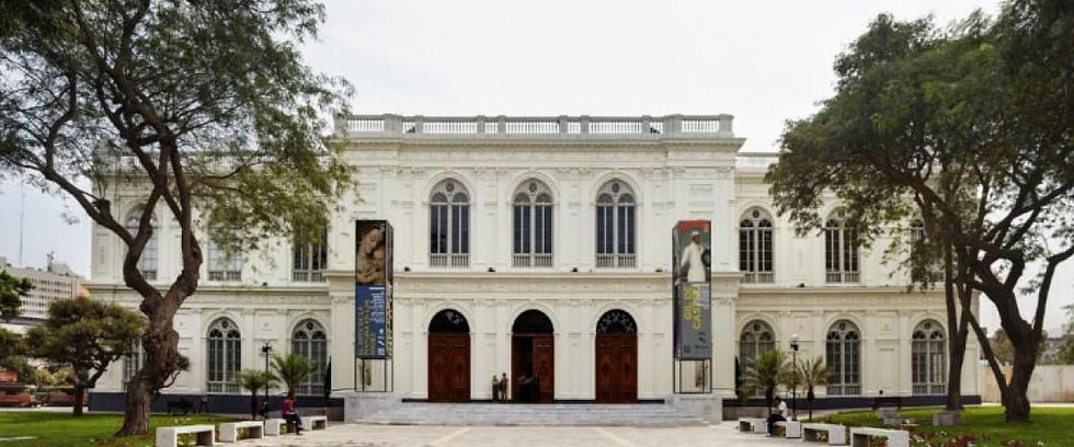 The historic white façade of the MALI building in Lima.