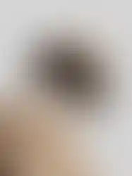 Close-up of QILO x SC Irregulars LHOTSE down puffer in AOR1, showcasing the removable hood