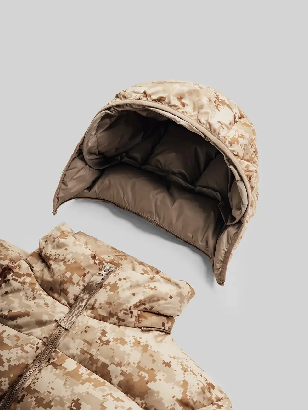 Close-up of QILO x SC Irregulars LHOTSE down puffer in AOR1, showcasing the removable hood