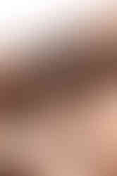 Detailed close-up of WRMFZY logo on the front button of QILO x WRMFZY EDC Mk. II Desert Tiger Stripe shorts