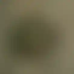 One Hundred Concepts HelmetScrim™ 2.0 in Multicam attached to a tactical helmet on a grainy backdrop