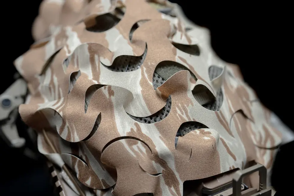 Detailed view of 3D laser cut pattern of a wearing a tactical helmet with One Hundred Concepts HelmetScrim™ 2.0