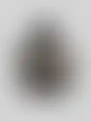 QILO x SC Irregulars LHOTSE down puffer in Maritime Grey front view. An MCX rifle is placed on top of the jacket.