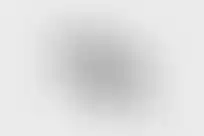 Angled side-view of Irregular Defense OMM PIC Gen 2 optic mount in black anodized finish