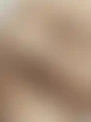 Close-up details of QILO x SC Irregulars LHOTSE down puffer in AOR1, showing the pull tab for adjusting the hood