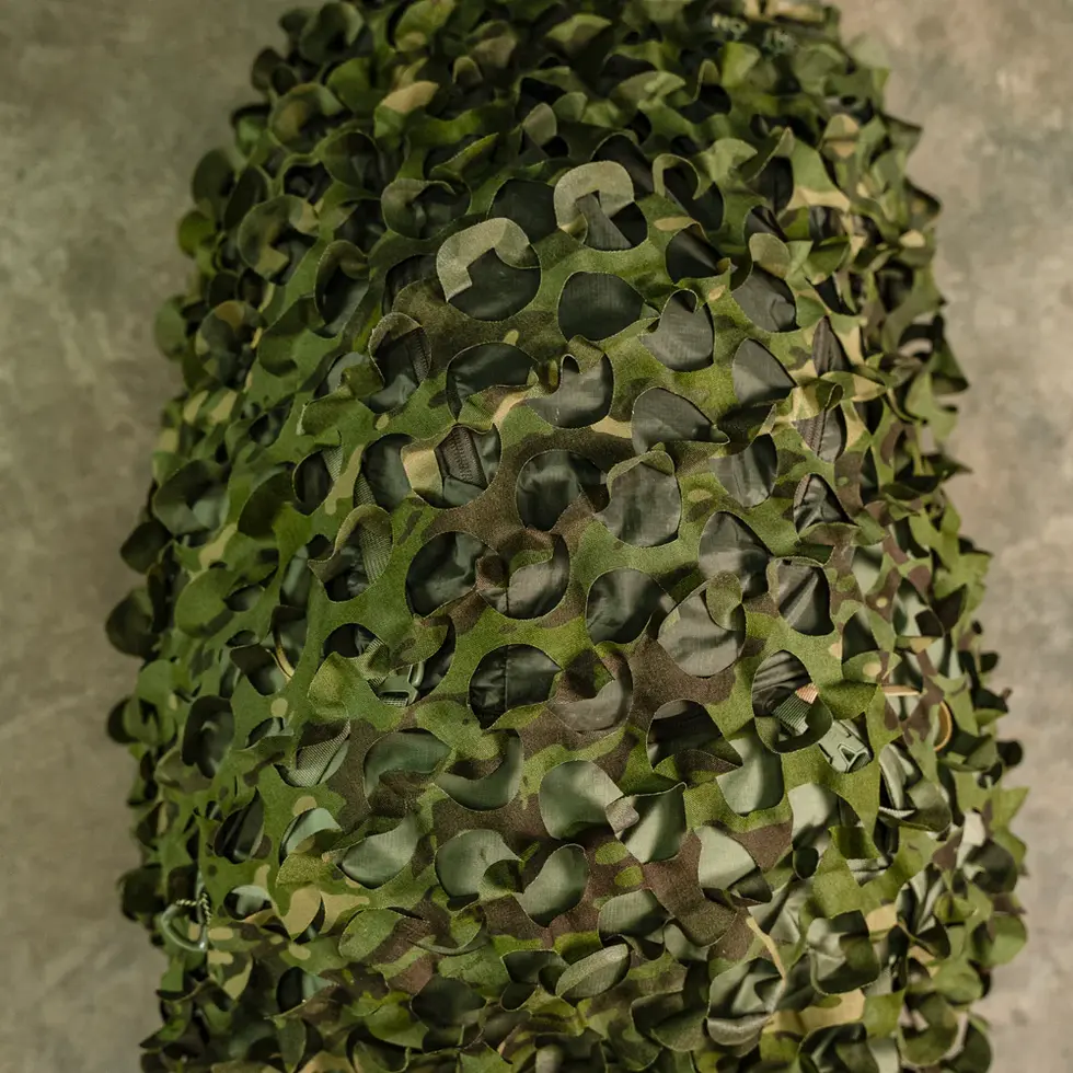 One Hundred Concepts PackScrim™ in Multicam Tropic, showing how the laser cut pattern creates a 3D shape for concealment