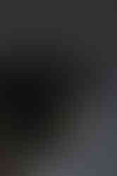 Dimly lit shot of an AR15 with a rifle light and a closed KOLIBRI.works DEKEL cap on it