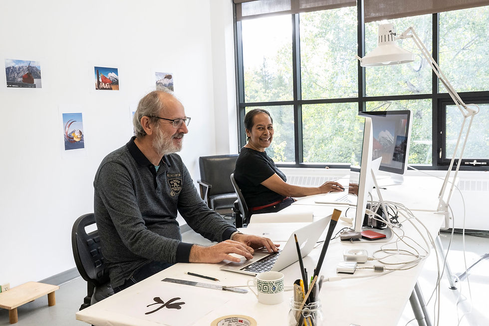Close-up view of hands sketching a collaborative art concept on paper