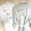 Thumbnail: white bride robe with leafy wreath and sage leafy wreath personalised robes