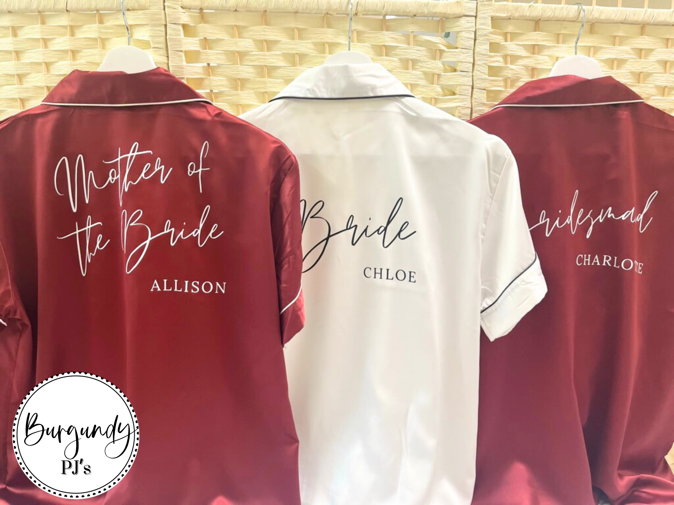 white and burgundy colours of personalised satin pyjamas, used for getting ready before the wedding.