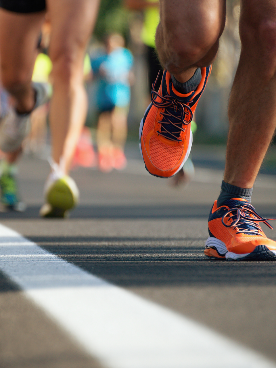 runners running on pavement 