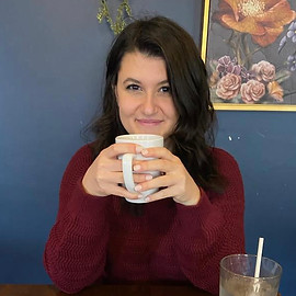 Melissa Line holding a cup of coffee