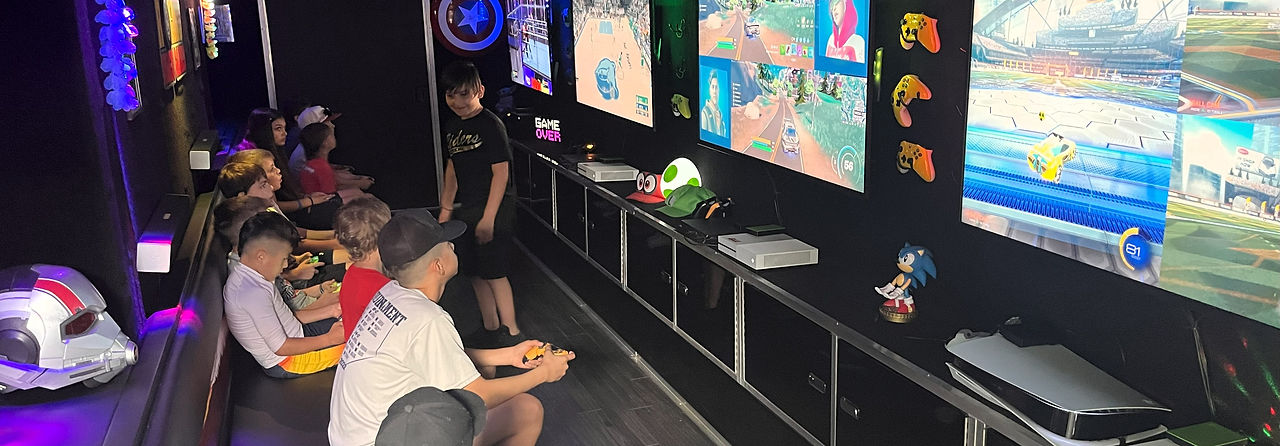 Interior view of a mobile gaming trailer during a party