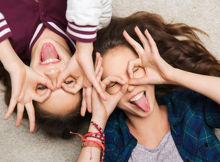 teenage girls pulling silly faces