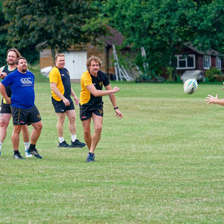Rugby player passes the ball. Barns Green rugby