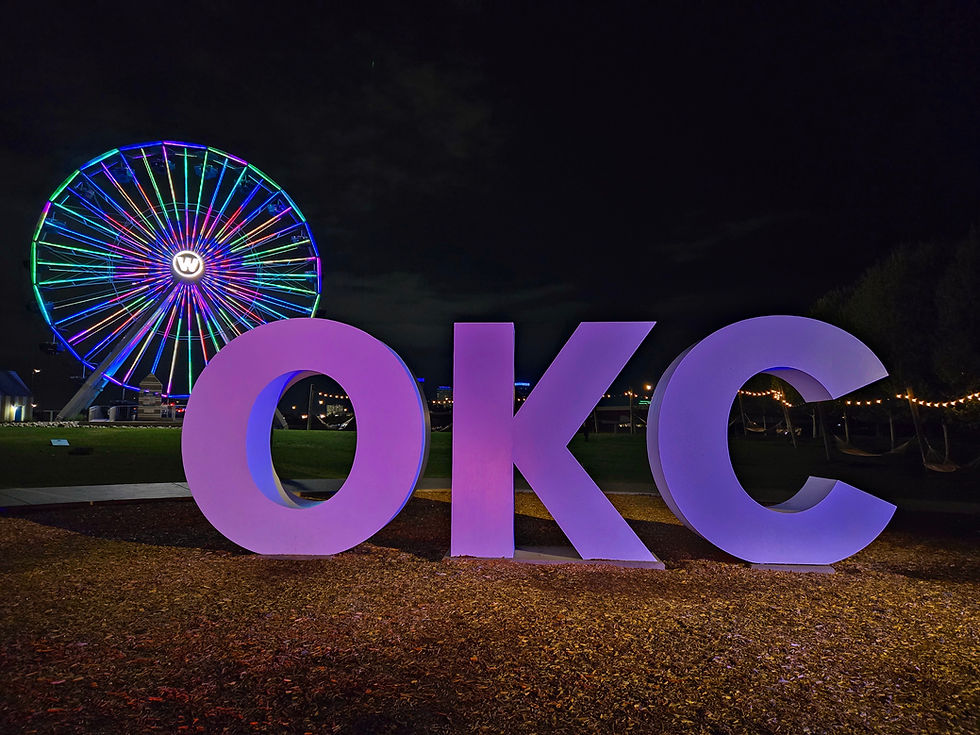 Welcome to OKC: Where the riverfront Ferris wheel frames the city’s famous ‘OKC’ letters.