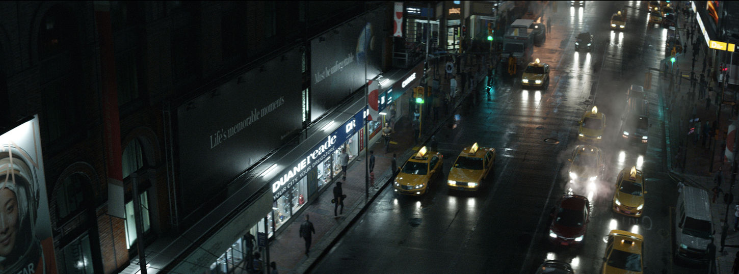 Night scene of taxis and traffic on a wet city street at night. CGI