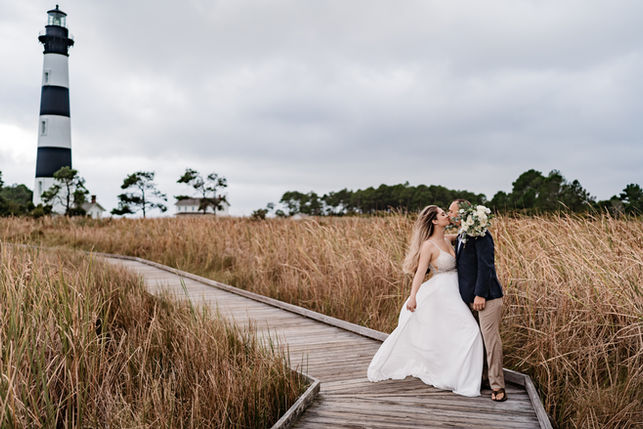Couple kissing on boardwalk, Wedding, tall grass background, MK Photography