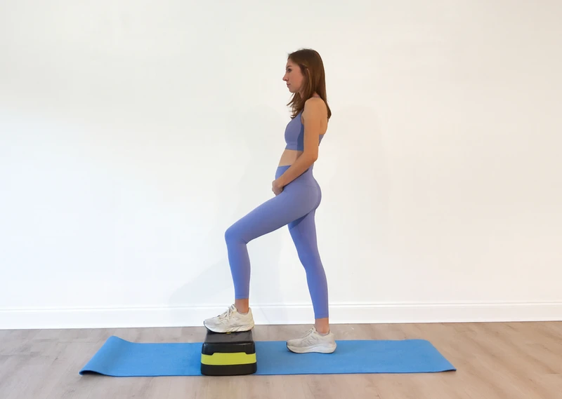 pregnant woman stepping up on an exercise step