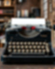 antique typewriter with vintage loft background vertical sizing.jpg