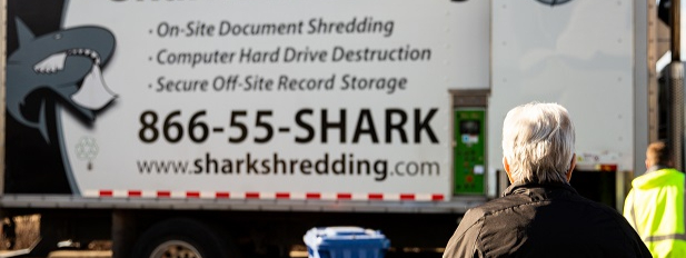 Woman witnessing the shredding process at Shark Shredding