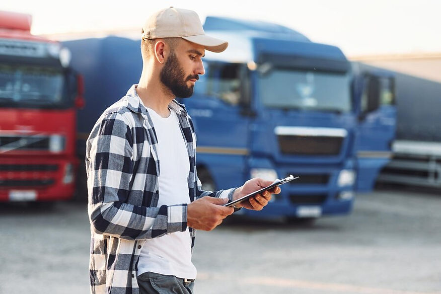 young-truck-driver-is-with-his-vehicle-daytime_146671-74368.jpg