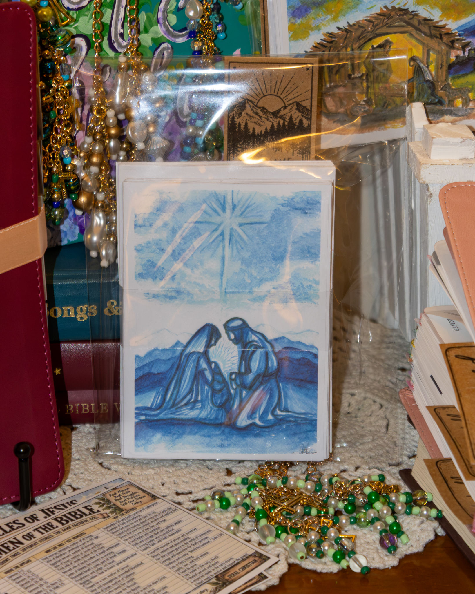 Christmas card collection featuring original watercolor Christian artwork by Sarah Beth Terry, including a blue Nativity