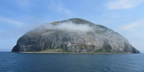 Ailsa Craig island with mist covering its rocky peak, east coast scotland