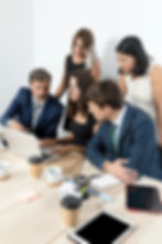 professional-employees-collaborating-medium-shot.jpg
