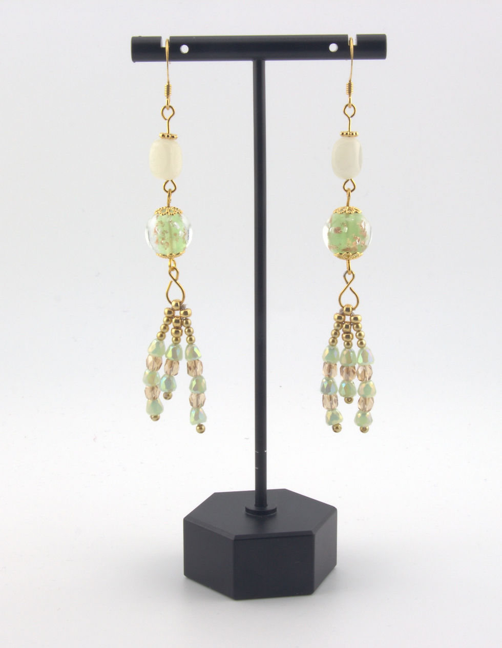 Earrings hanging from stand - Lampwork Glowing Globe and Serpentine Chandelier Earrings