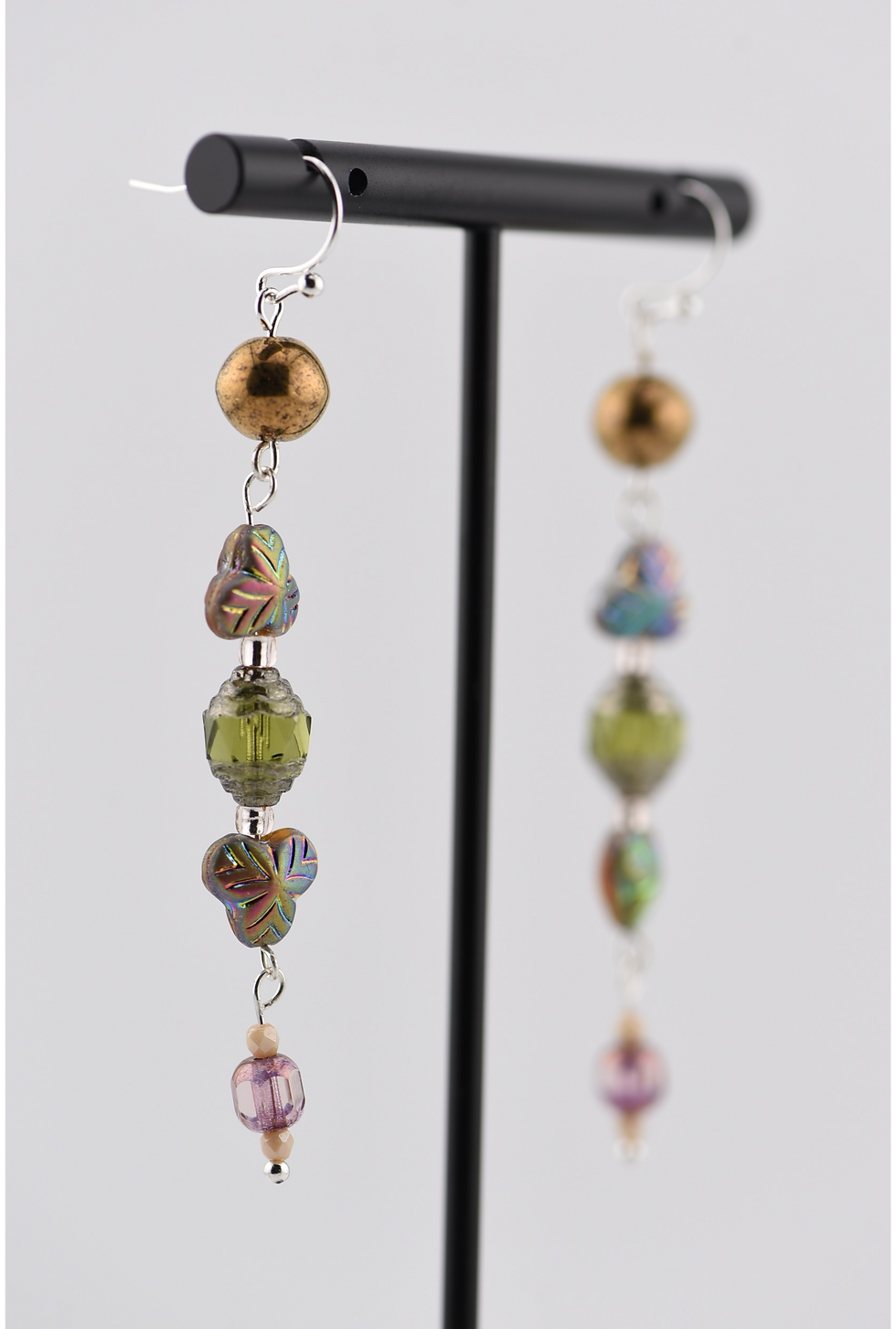 Thumbnail: Angled view of earrings hanging from stand - Cathedral and Clover Bead Earrings