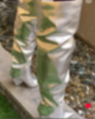 Shiny silver thigh high boots, stylish footwear, outdoor setting, 