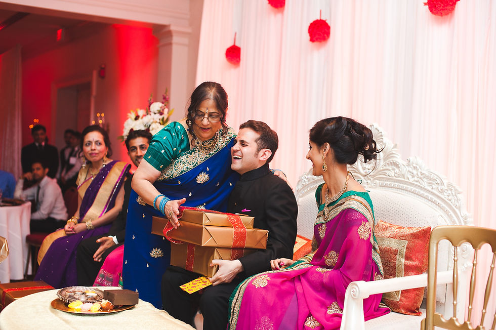 Traditional Indian wedding ceremony surrounded by family and guests