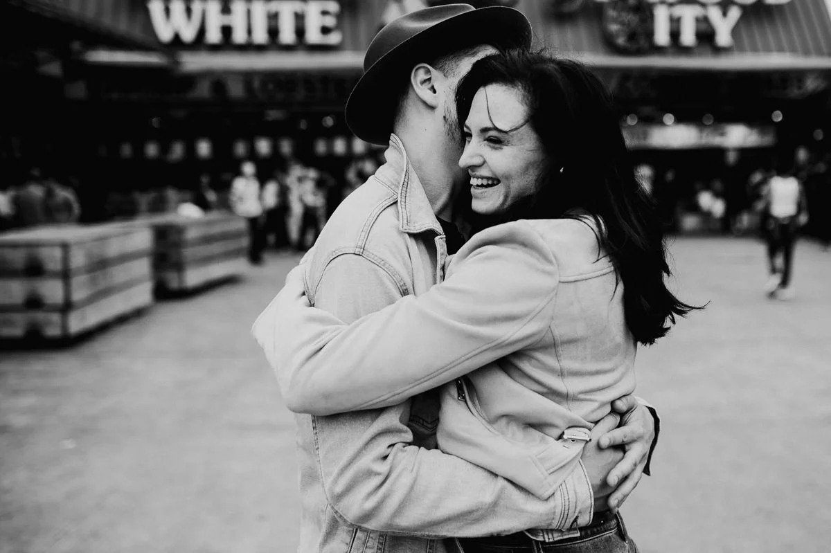 Black-and-white portrait of an engaged couple at The Wharf waterfront in Washington, DC.