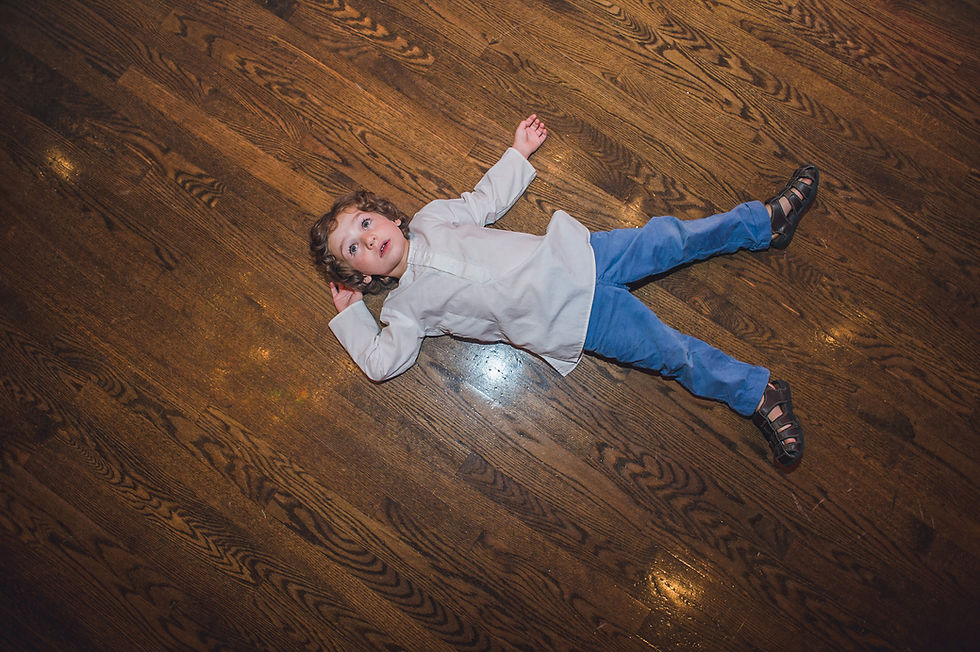 Child playing on the dance floor during the wedding reception