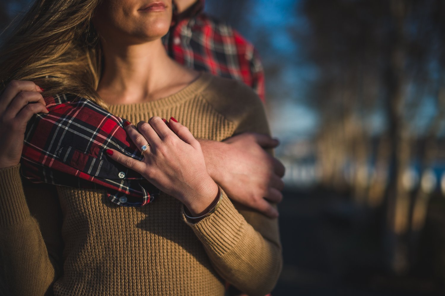 Close portrait detail of an engaged couple holding hands at Yards Park in Washington, DC.