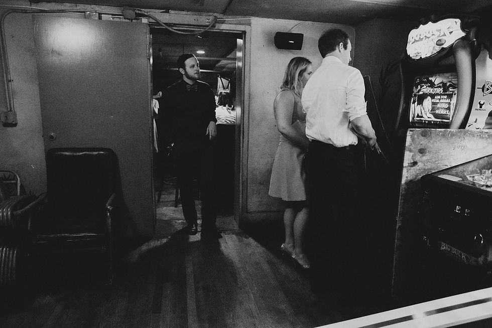 Couple walks through a dim corridor