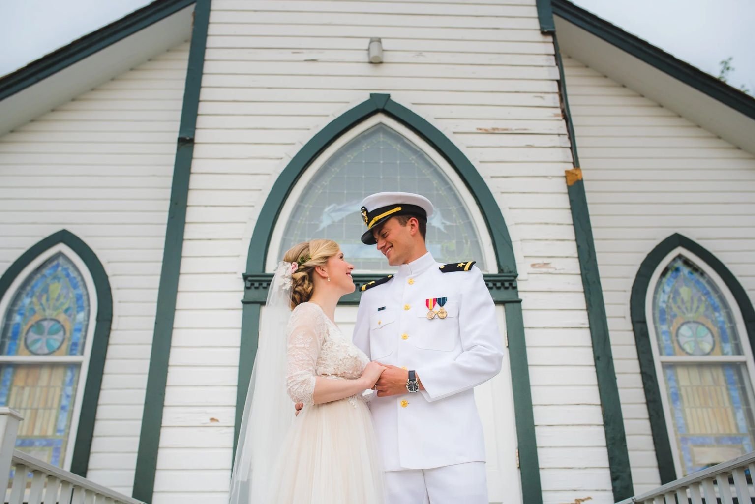 Bride and groom sharing a quiet moment outside a historic Washington, DC church during an intimate elopement ceremony.
