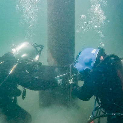 Commercial Divers Installing a Pile Jacket.