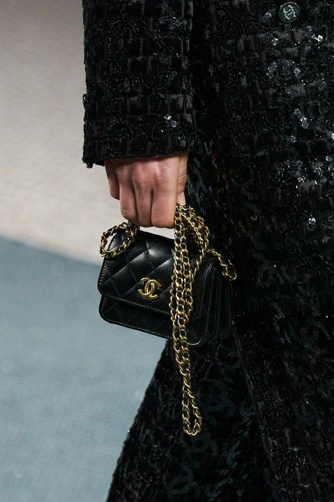 Model with bag of Chanel in hands