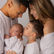 newborn baby photographed with family in relaxed environment