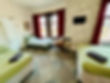 Family room at Leatham Park Hotel Blackpool with beds and TV