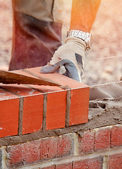 stock-photo-industrial-bricklayer-laying-bricks-cement-mix-construction-site.jpeg