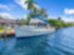 White trawler yacht docked in a tropical trawler photo gallery