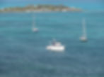 White boat from the trawler photo gallery near an island